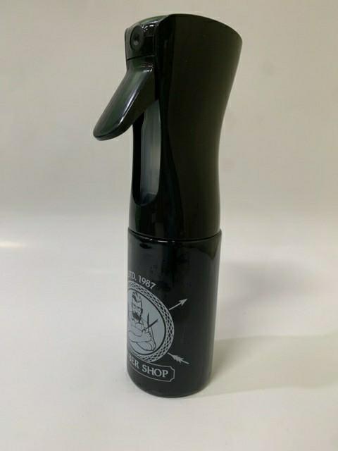 Premium Photo  Barber spray gun is located on a black marble slab