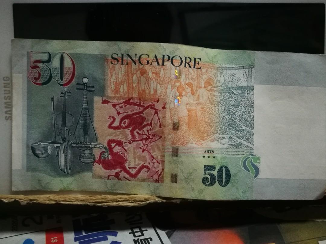 Extra wording (Category: Currency) located in Singapore. Submitted by junkrecyclemachine (Listing ID 285169045, Image 2). Description: this pcs of 50 note have extra number on it . maybe wrong print.