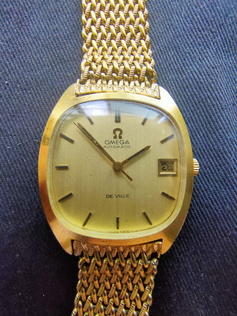omega gold watch value