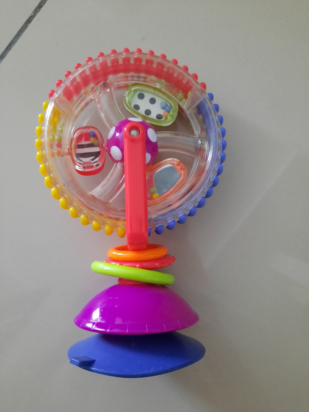 sassy developmental wonder wheel suction toy