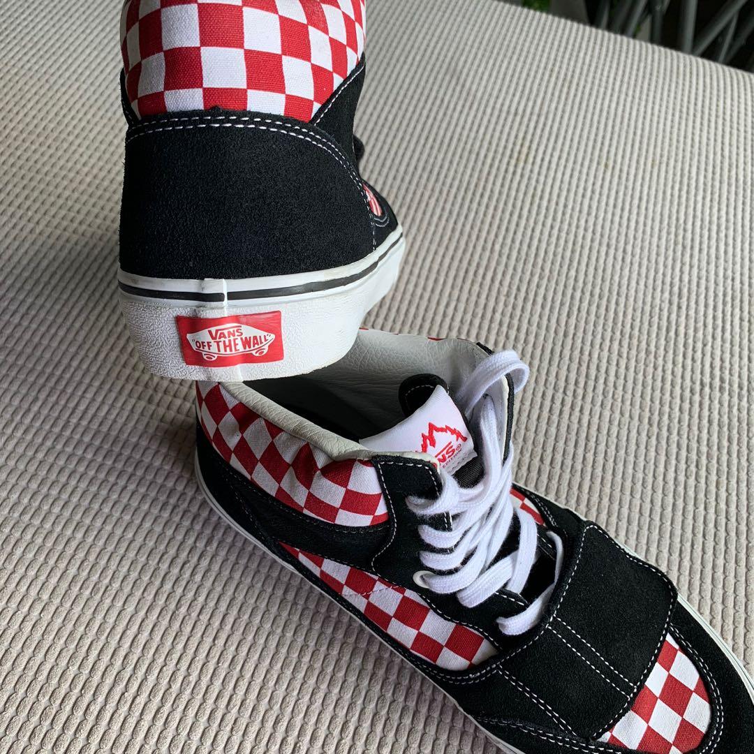Red and black checkerboard vans journeys store