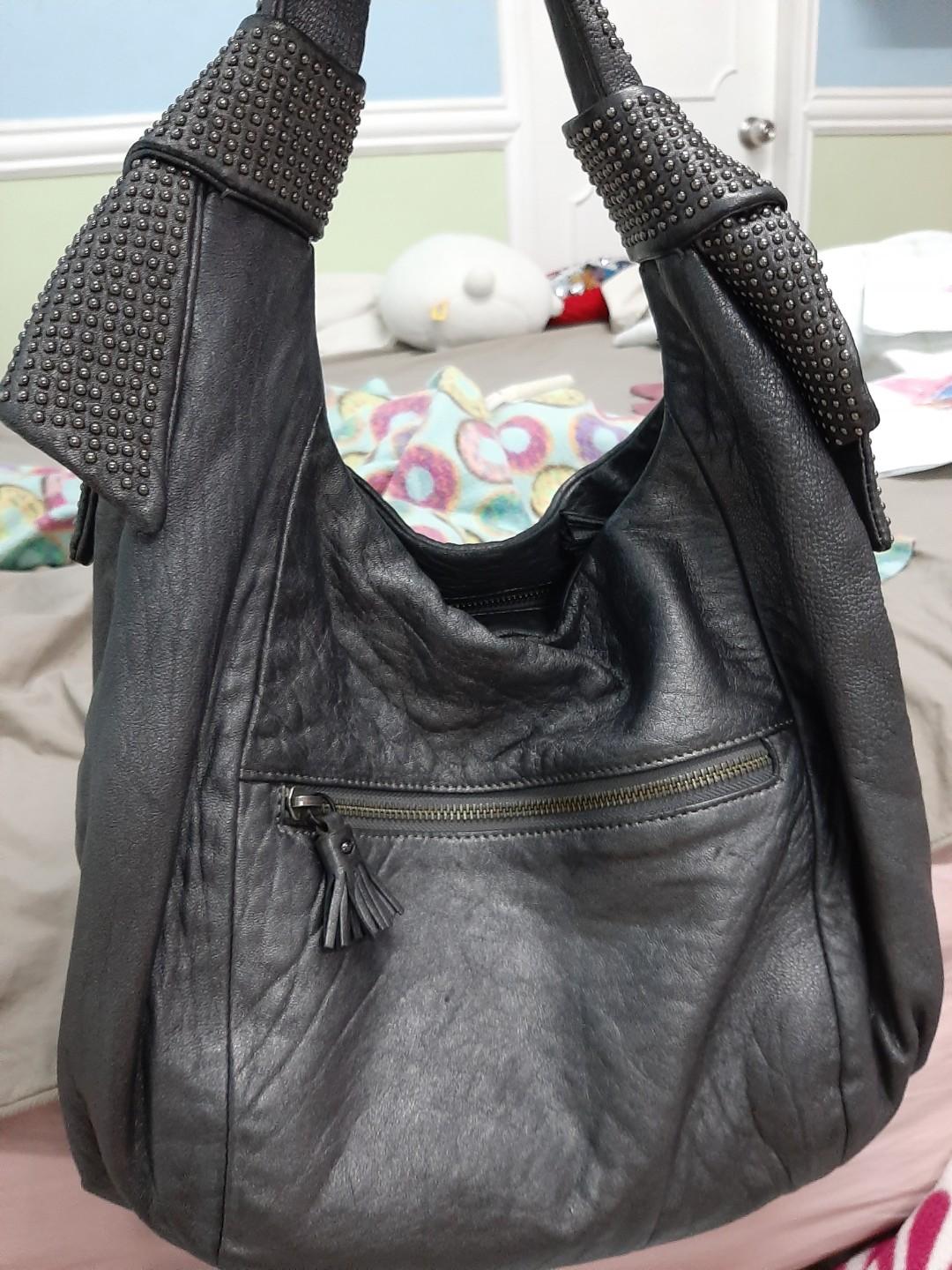 Anya Hindmarch Bag (Category: Luxury Bags & Wallets) located in Paranaque City. Submitted by andim8 (Listing ID 285554019, Image 2). Description: Anya Hindmarch Peggy Bag in Pewter, studded handle. Rank AB 9/10. Guaranteed Authentic. No notable flaws.