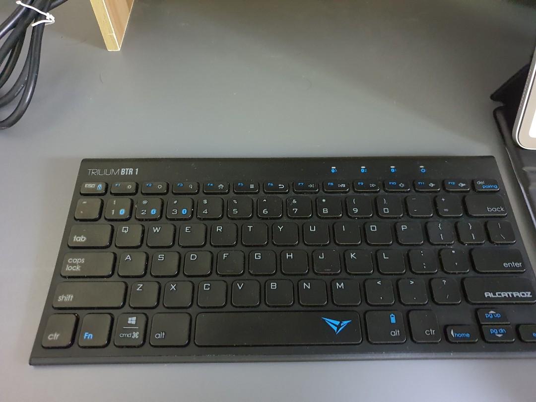 Bluetooth wireless keyboard (Category: Computer Keyboard) located in Singapore. Submitted by jonathanlhh (Listing ID 285642821, Image 1). Description: Alcatroz Trilium BTR 1 Challenger retails at $49.90 Rarely used, RFS: mostly on my ipad and seldom use PC anymore. Bought less than a year but cant rmb exactly when. No dongle needed..