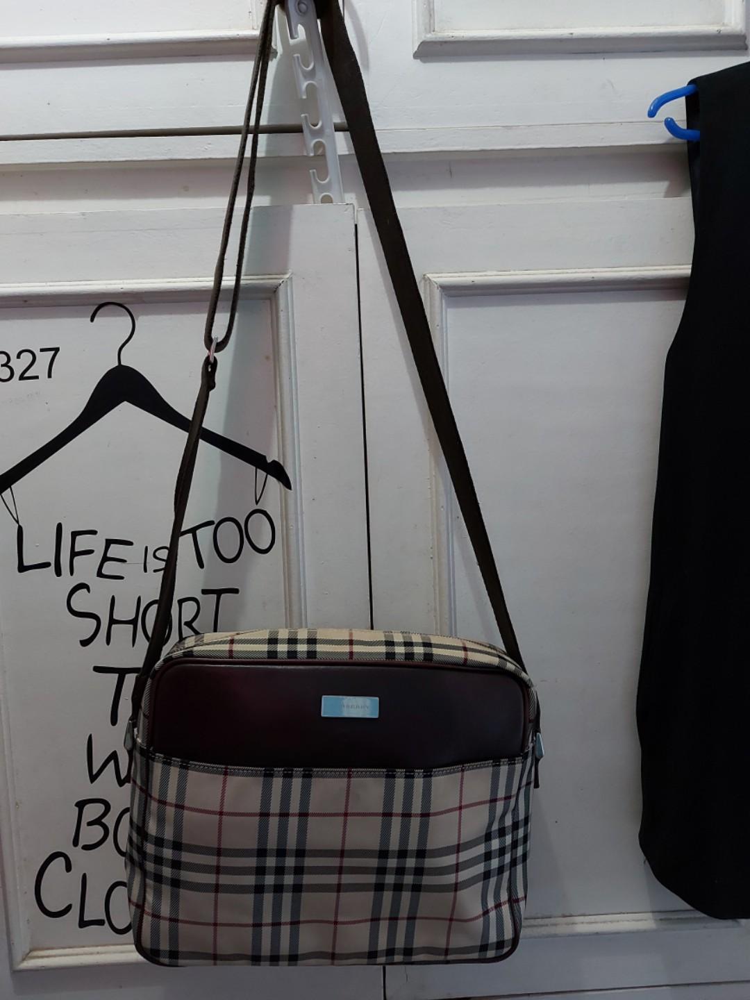 Burberry sling bag original (Category: Luxury Bags & Wallets) located in Manila. Submitted by beabi041582 (Listing ID 285956254, Image 1). Description: burberry sling bag 8.5 x 11 x 3.5 clean i side and out and in good condition with flaw on one corner , bought from japan.