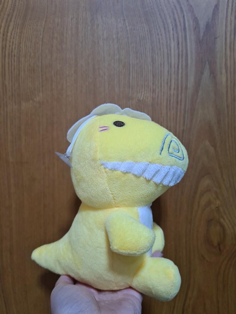 yellow stuffed dinosaur