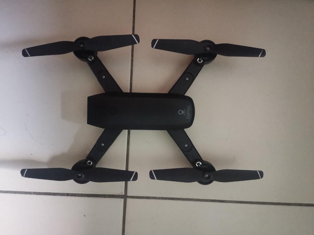 Drone (Category: Drones) located in Singapore. Submitted by givemetea (Listing ID 286724539, Image 3). Description: Drone come with 2 camera, Front and bottom With GPS tracking capability With extra set of blades and with 6 battery (15min each) Able to take pictures and video, can live feed or control thru phone. If need can add on to one mini VR glasses.