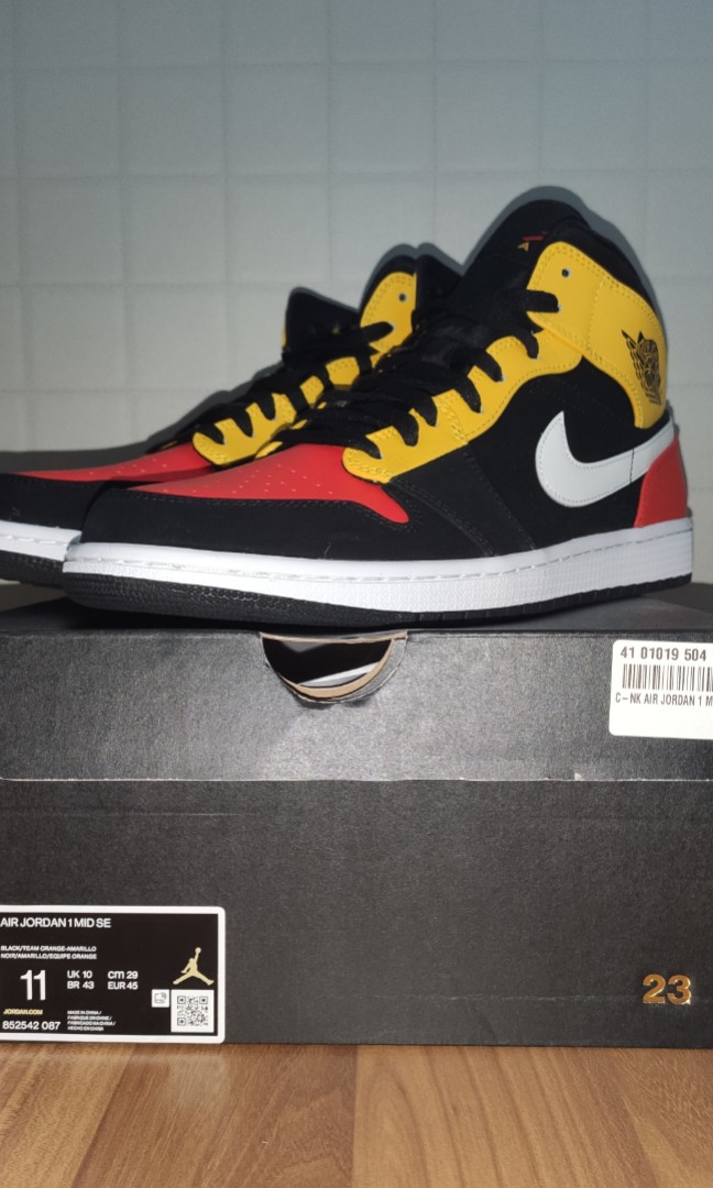jordan 1 mid black amarillo orange