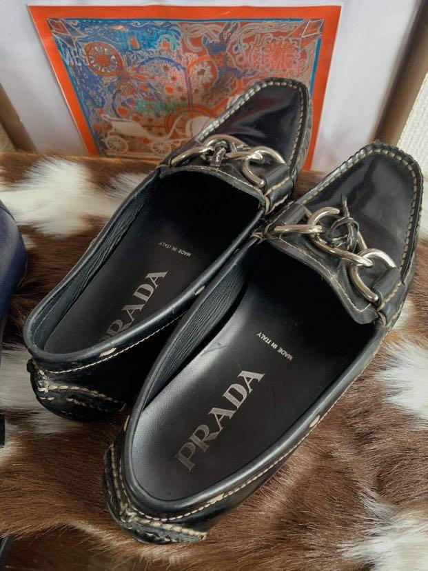 Leather chain store loafers by prada