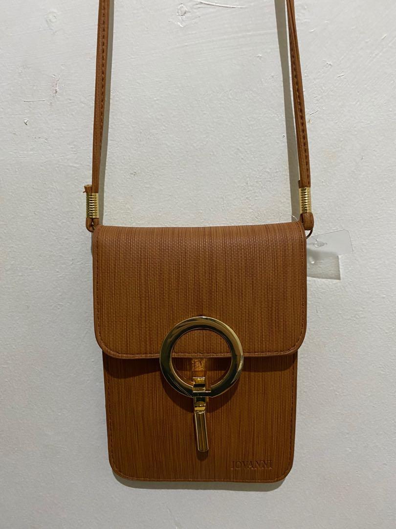 Small sling bag (Category: Cross-body Bags) located in Paranaque City. Submitted by closedcycle (Listing ID 1040880332, Image 2). Description: It has a very nice brown color It was a gift to me but it was never used .