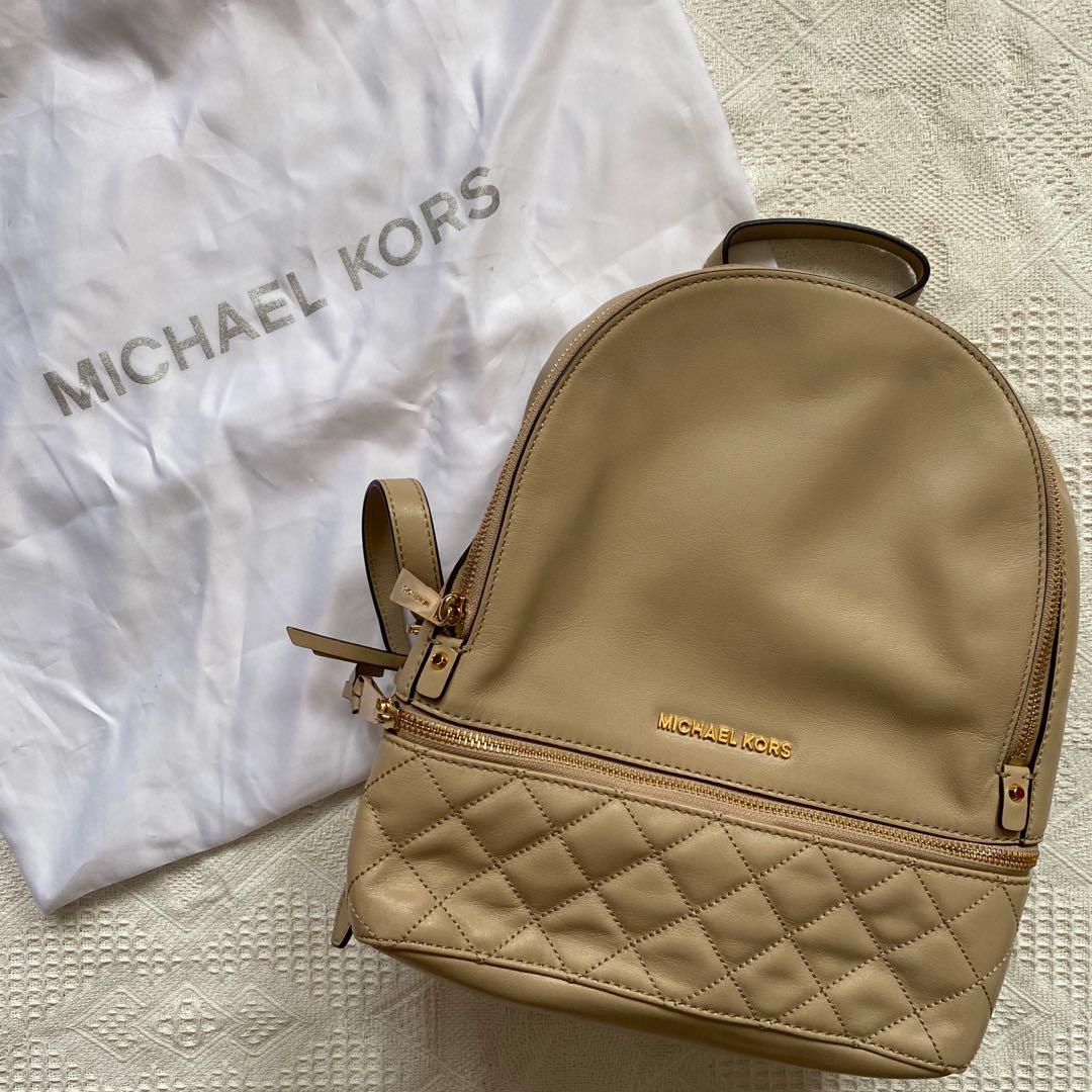 Michael Kors Rhea Zip Backpack, Luxury, Bags & Wallets on Carousell