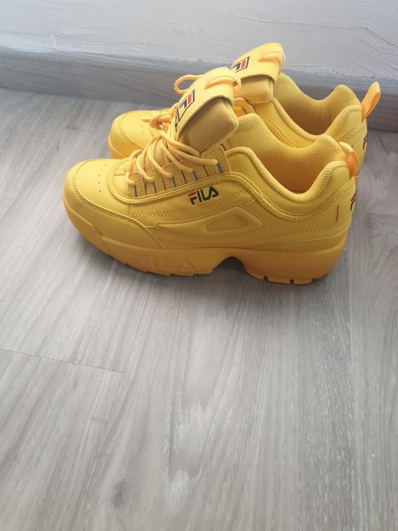 yellow and white fila shoes