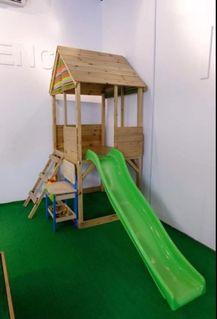 wooden playhouse and slide