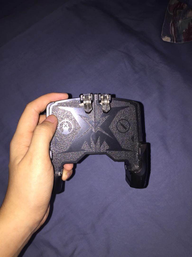 Mobile Gamepad K21 Controller (Category: Controllers) located in San Juan City. Submitted by thriftytrippy (Listing ID 1041812715, Image 2). Description: - Mobile controller for touch-screen FPS Gun Games (CODM, PUBG, ROS) - Condition 10/10 signs of usage but functions just as well .