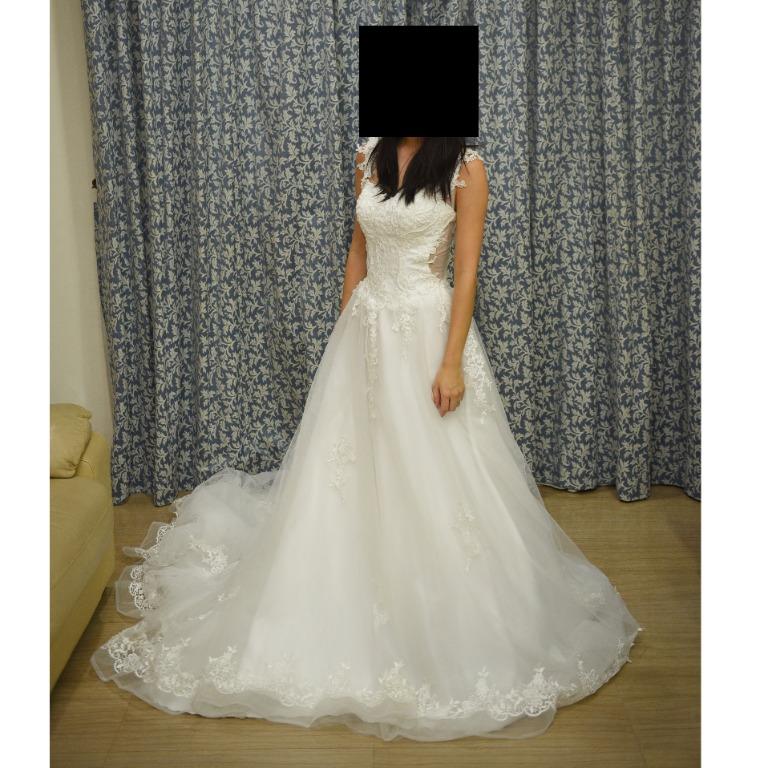 Wedding gown (Category: Evening dresses & gowns) located in Singapore. Submitted by ch001 (Listing ID 1041878708, Image 3). Description: Wedding gown with long train and nice details for sale. open to negotiation Bought used at $350 to be worn on actual day but ended up going for another gown. Time to clear it out Deal at kovan, about 10 minutes walk from mrt. Can deal at mrt if dont need to try on. If interested please pm me, thanks!.