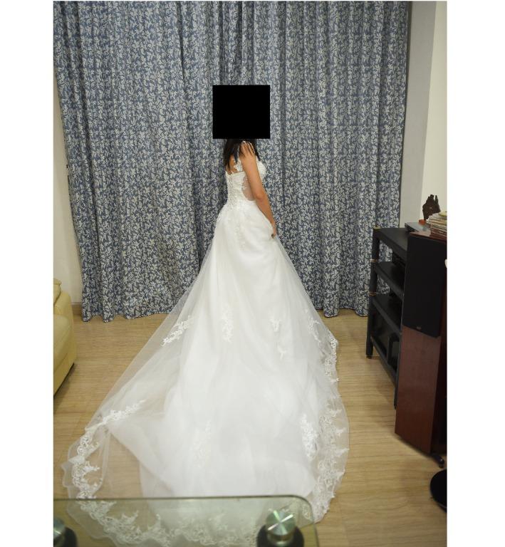 Wedding gown (Category: Evening dresses & gowns) located in Singapore. Submitted by ch001 (Listing ID 1041878708, Image 2). Description: Wedding gown with long train and nice details for sale. open to negotiation Bought used at $350 to be worn on actual day but ended up going for another gown. Time to clear it out Deal at kovan, about 10 minutes walk from mrt. Can deal at mrt if dont need to try on. If interested please pm me, thanks!.
