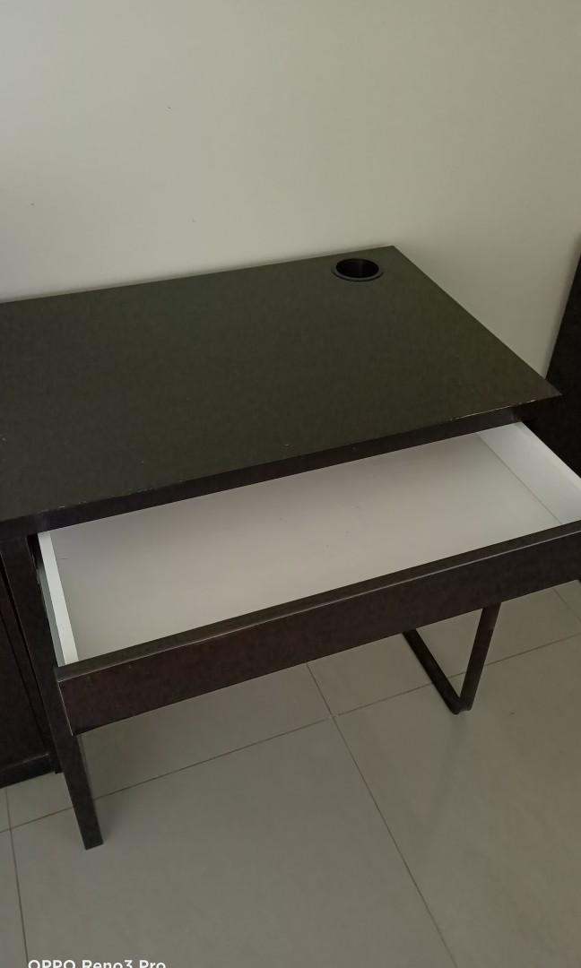IKEA study table (Category: Tables & Sets) located in Singapore. Submitted by caring888 (Listing ID 1042059965, Image 2). Description: Selling a good condition IKEA desk with drawer. Black-brown, 73cm x 50cm. Please note: 1) One stretch of colour faded off (see 3rd pic). 2) One stationary holder at the side (see last pic) Self-collect at Bedok Reservoir Road (nearest mrt: Kaki Bukit) #ikea desk #ikea study table.