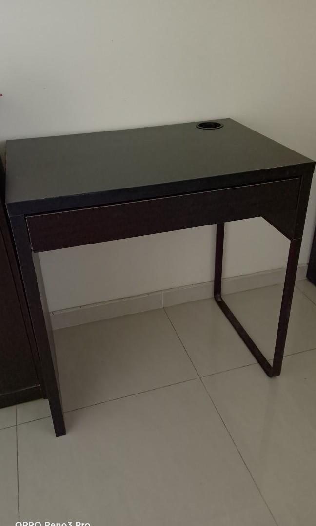 IKEA study table (Category: Tables & Sets) located in Singapore. Submitted by caring888 (Listing ID 1042059965, Image 1). Description: Selling a good condition IKEA desk with drawer. Black-brown, 73cm x 50cm. Please note: 1) One stretch of colour faded off (see 3rd pic). 2) One stationary holder at the side (see last pic) Self-collect at Bedok Reservoir Road (nearest mrt: Kaki Bukit) #ikea desk #ikea study table.