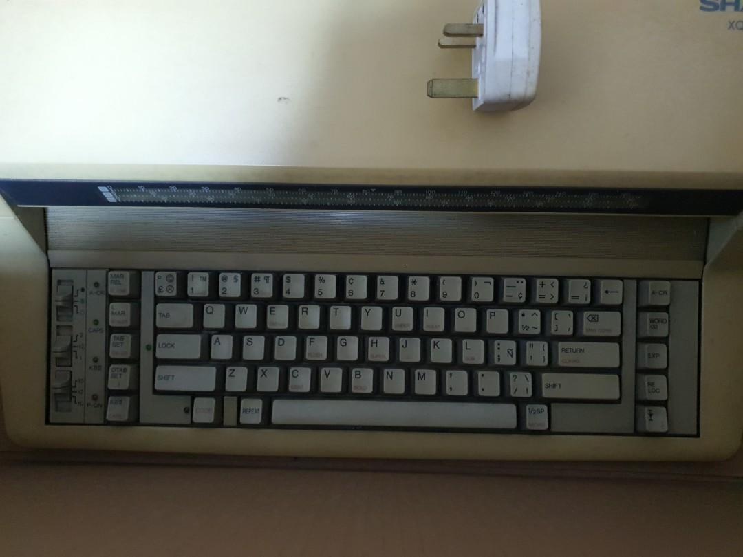 Sharp Type Writer (Category: Office & Business Technology) located in Singapore. Submitted by pinkyshake (Listing ID 1042302677, Image 3). Description: Sharp XQ-315 electronic type writer. working condition.