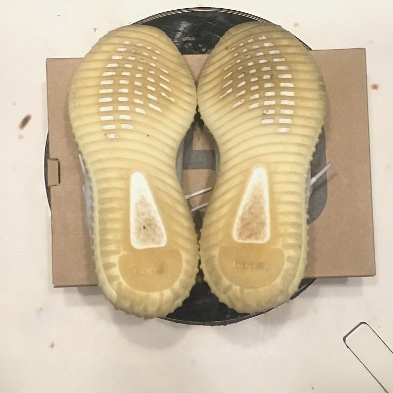 Adidas YEEZY 350 Boost V2 "Cream White" (Category: Sneakers) located in Malabon City. Submitted by lowretss (Listing ID 1042702944, Image 2). Description: Condition (8/10), issue shows dirt and slight yellowing as a sign of use, but definitely is still definitely durable and intact. It comes with its original box. The fitting of the 350 V2's are true-to-size, so it perfectly fits a US9.5 and a US10. The luminous colored Yeezy Boost 350 has a crea