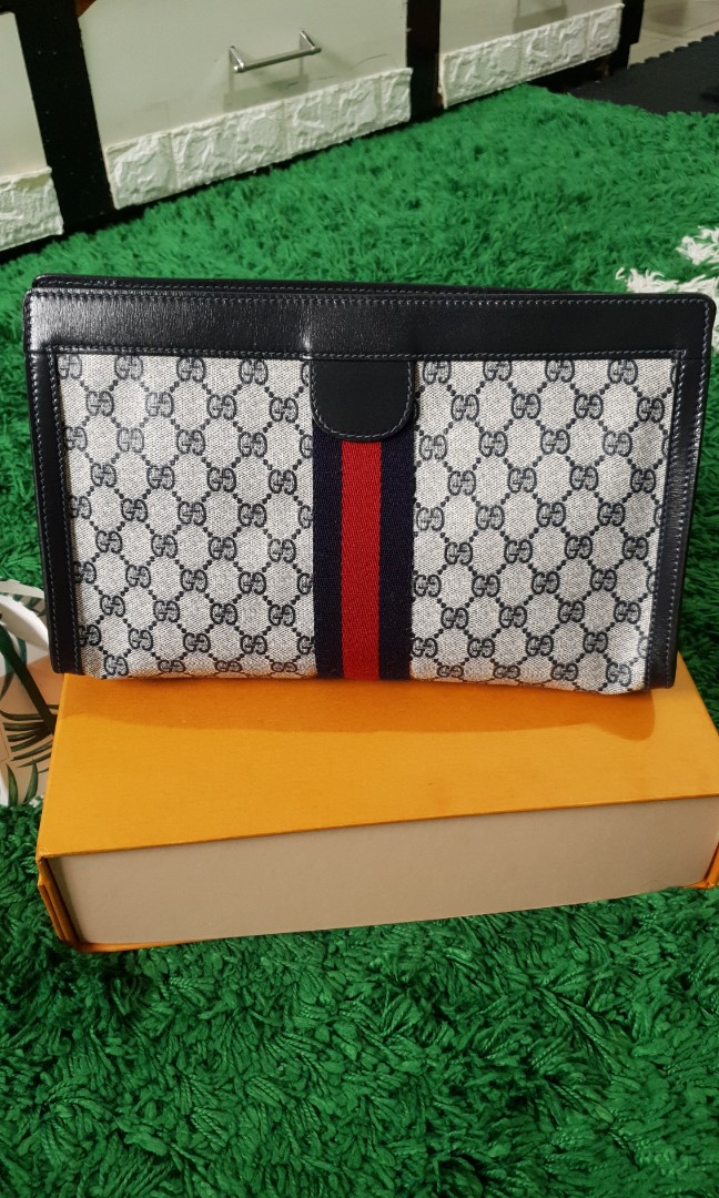 GUCCI clutch, Luxury, Bags & Wallets on Carousell