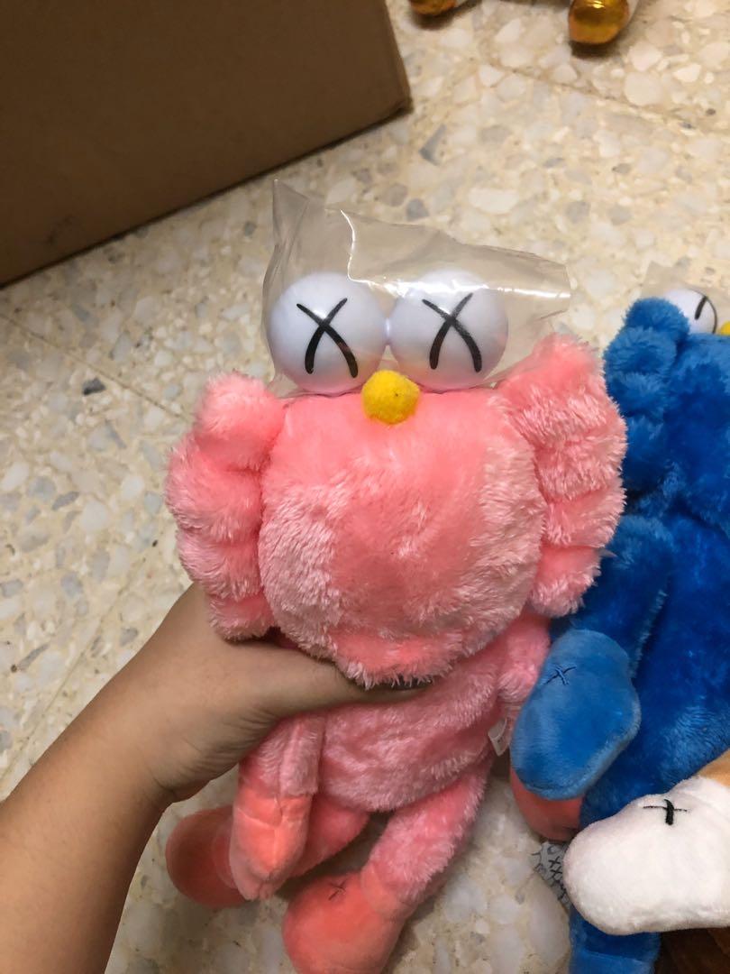 KAWS (Category: Plushies & Soft Toys) located in Singapore. Submitted by princessjamie (Listing ID 1042587696, Image 3). Description: 💗🧸Hello! MAJOR SOFT TOY SALE🧸💗 ▪️Soft toy: Kaws ▪️Description: Sesame Streets Kaws ▪️Condition: 10/10 ▪️Price: $18 ( I HAVE 2 PINK, 2 BLUE, 2 BROWN-WHITE ) I got a whole box of soft toys to clear! We have many popular and adorable characters! Do check out my listing for more! Please help us clear as all of thes