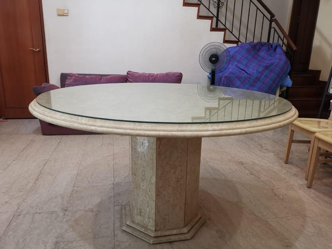 Marble Dining Table (Category: Tables & Sets) located in Singapore. Submitted by badbatzkoh (Listing ID 1042575311, Image 2). Description: Pre-loved genuine marble table previously bought at $2,400, now selling at below half price! It's well maintained and in pristine condition, protected by a custom-made glass top that costs more than $300, which we'll throw in free of charge! Diameter 137cm as shown on the 3rd picture, can sit 8 pax comfortably