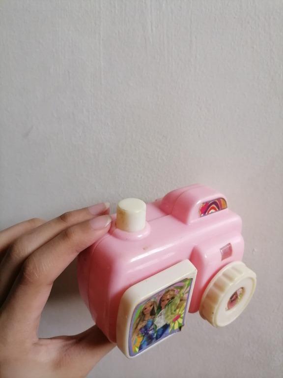 Pink Barbie Camera Toy (Category: Cameras) located in San Mateo. Submitted by Babyfume (Listing ID 1042601067, Image 3). Description: great quality BOUGHT IN THE MIDDLE EAST GOOD AS NEW the button for 'picture taking' is fully functional makes camera clicking noises a neck strap or lace can be added on the side the round knob is for zooming the picture no damage, no stains can be used for decor on kids room or paper weight message for more detail