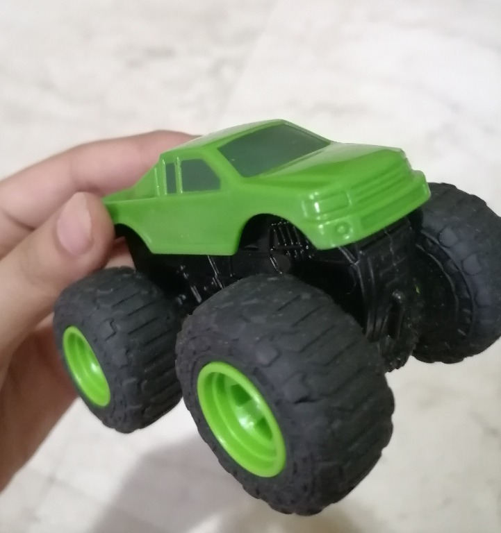 Green monster truck toy top
