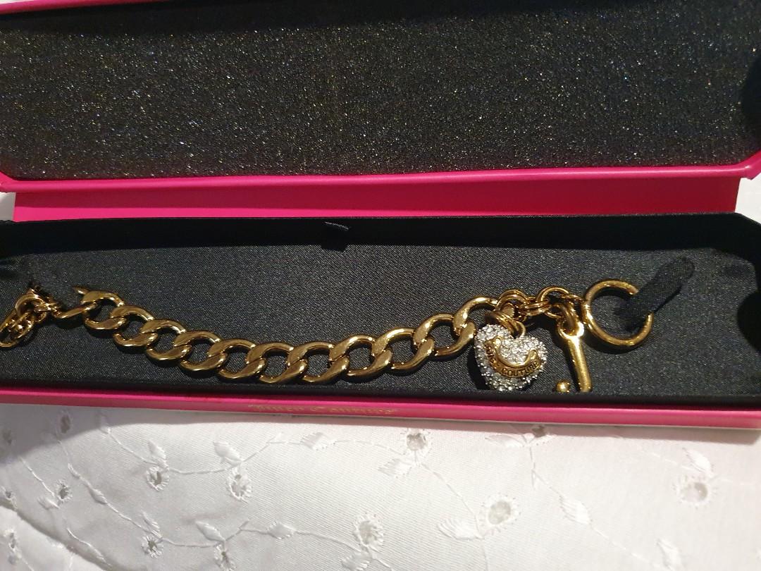 Juicy Couture Gold ID Bracelet (Category: Sneakers & Footwear) located in Makati City. Submitted by AnnaK (Listing ID 1042745962, Image 3). Description: Never Been Used Gold Plated ID Bracelet with Cubic Zirconia Heart Charm and J initial Charm. 7inches in length. Very feminine and dainty💫.