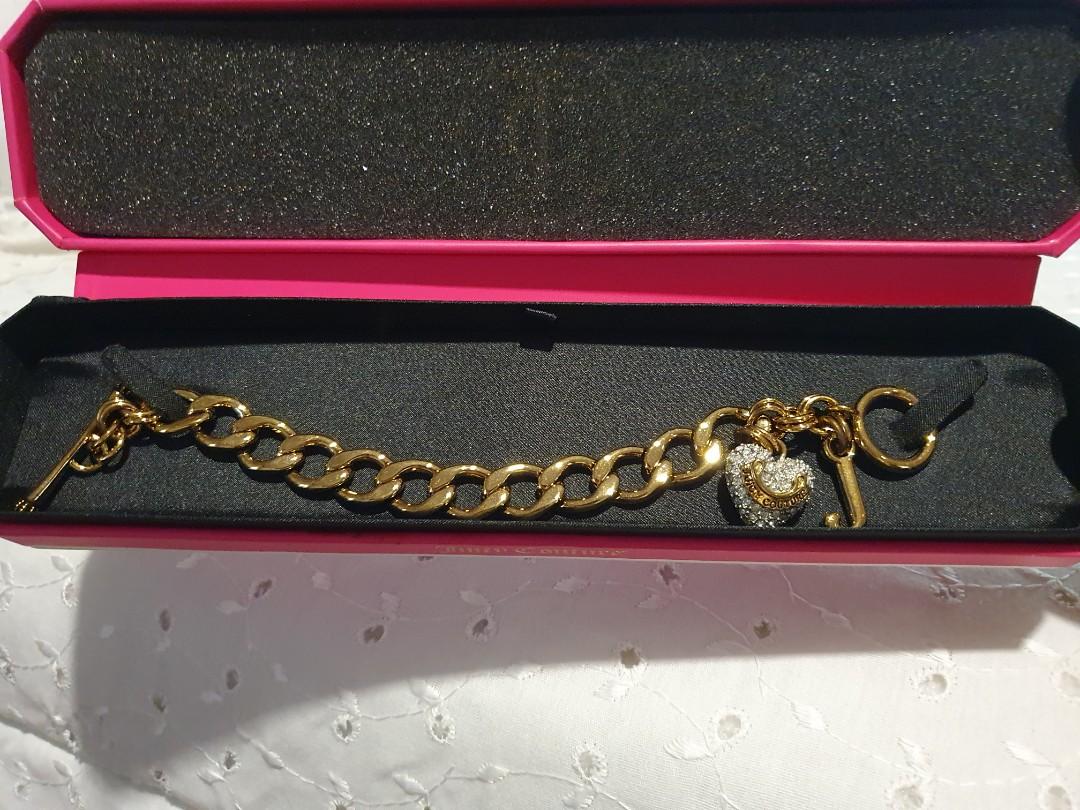 Juicy Couture Gold ID Bracelet (Category: Sneakers & Footwear) located in Makati City. Submitted by AnnaK (Listing ID 1042745962, Image 1). Description: Never Been Used Gold Plated ID Bracelet with Cubic Zirconia Heart Charm and J initial Charm. 7inches in length. Very feminine and dainty💫.