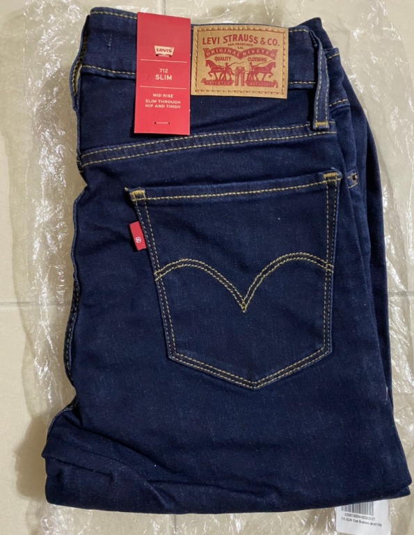 Levi's 712 Slim Mid Rise Jeans Size W27 L32 Dark Blue, Women's Fashion,  Bottoms, Jeans & Leggings on Carousell