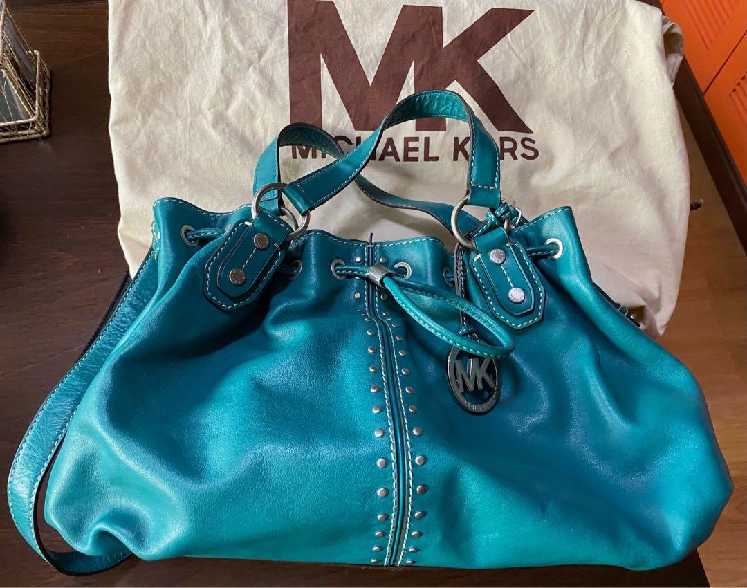 Original Michael Kors Leather Handbag w/ Sling Strap (Category: Luxury Bags & Wallets) located in Las Pinas. Submitted by mariamorada (Listing ID 1043010073, Image 3). Description: Leather handbag with sling strap in excellent condition. Comes with a dust bagx.