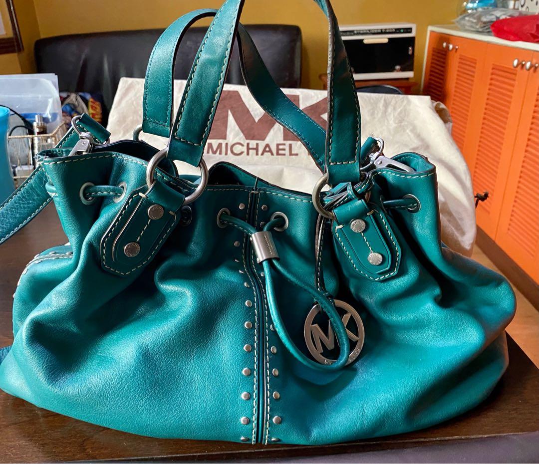 Original Michael Kors Leather Handbag w/ Sling Strap (Category: Luxury Bags & Wallets) located in Las Pinas. Submitted by mariamorada (Listing ID 1043010073, Image 1). Description: Leather handbag with sling strap in excellent condition. Comes with a dust bagx.