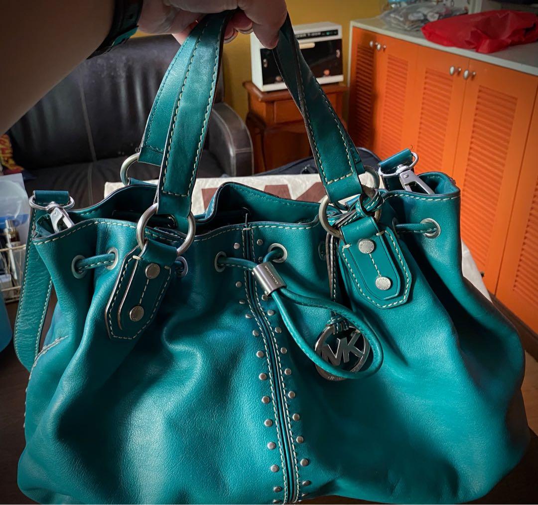 Original Michael Kors Leather Handbag w/ Sling Strap (Category: Luxury Bags & Wallets) located in Las Pinas. Submitted by mariamorada (Listing ID 1043010073, Image 2). Description: Leather handbag with sling strap in excellent condition. Comes with a dust bagx.