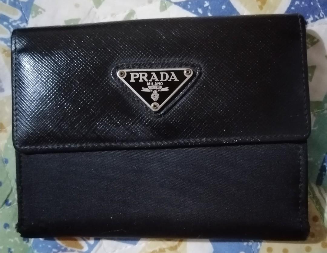 Sale!!! PRADA Fold wallet (Category: Luxury Bags & Wallets) located in Quezon City. Submitted by joykawaii_fashionboutique (Listing ID 1043187041, Image 1). Description: Fold wallet with coin purse, card holder and 2 space for money bills. 😁 Unique style 😍 Classy🤗.
