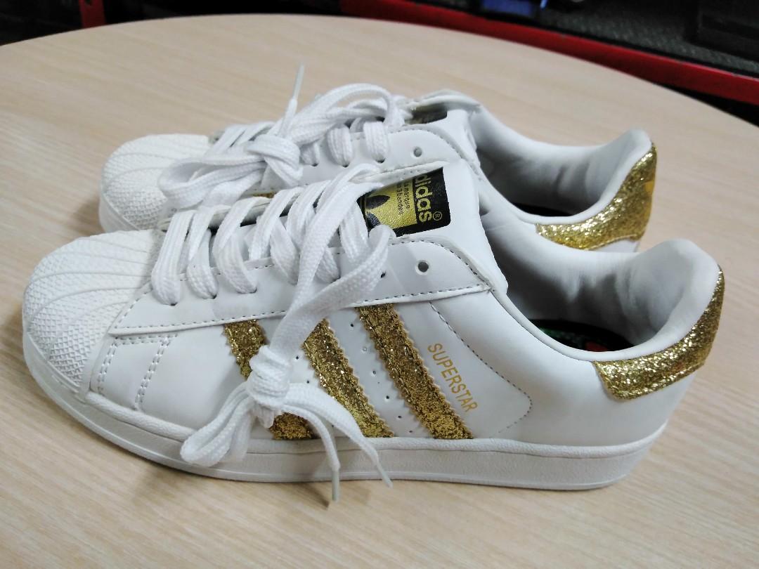Adidas superstar hotsell with glitter stripes