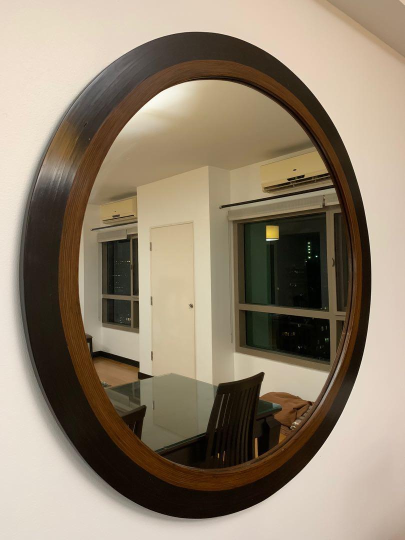 Solid wood custom built round mirror (Category: Mirrors) located in Makati City. Submitted by kelly17li (Listing ID 1038951184, Image 1). Description: Diameter : 121.7 cm Thickness : 2.3 cm Great accent piece Rfs: moving out .