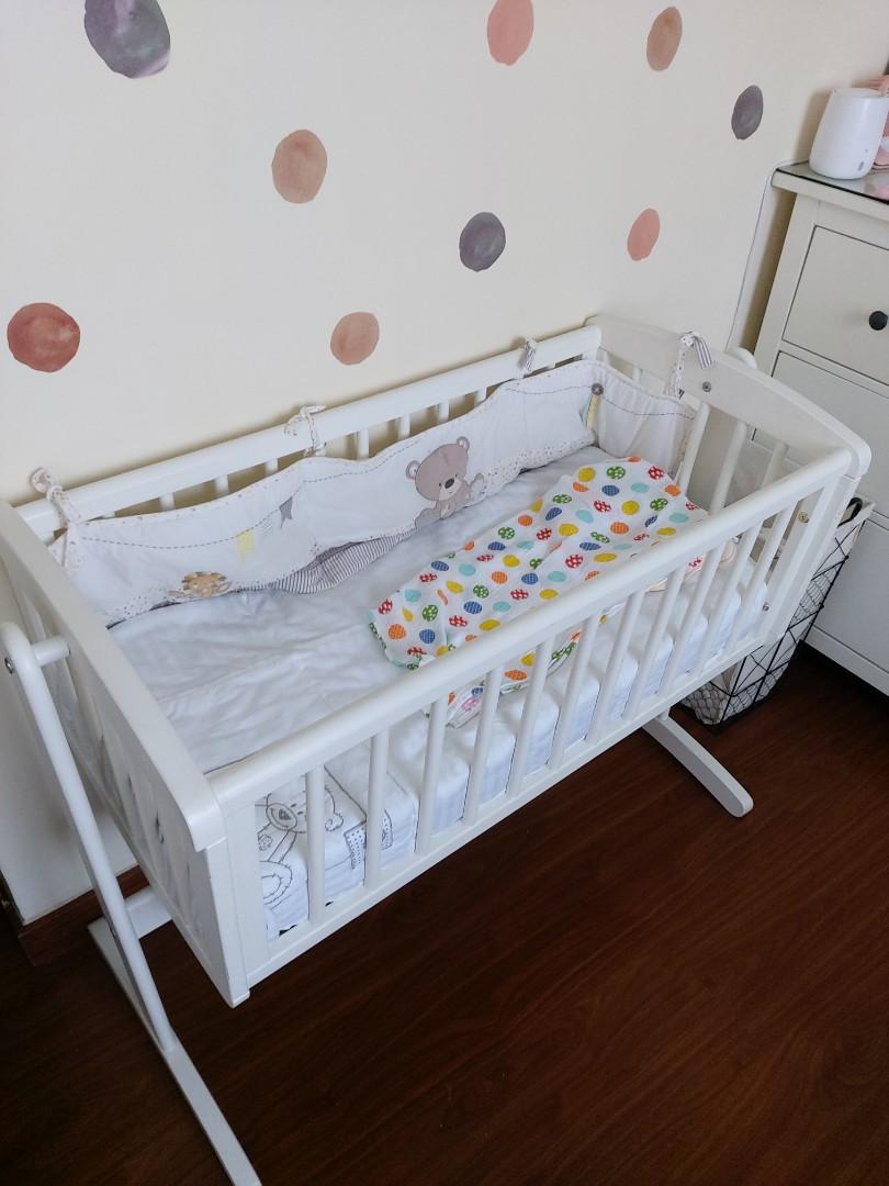 Crib with swing clearance