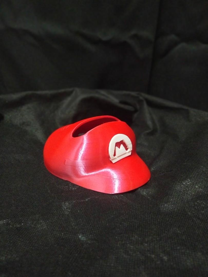 Nintendo switch stand (Category: Controllers) located in San Jose del Monte. Submitted by jkarllaker (Listing ID 1043837220, Image 3). Description: nintendo switch holder mario hat with charging port access.
