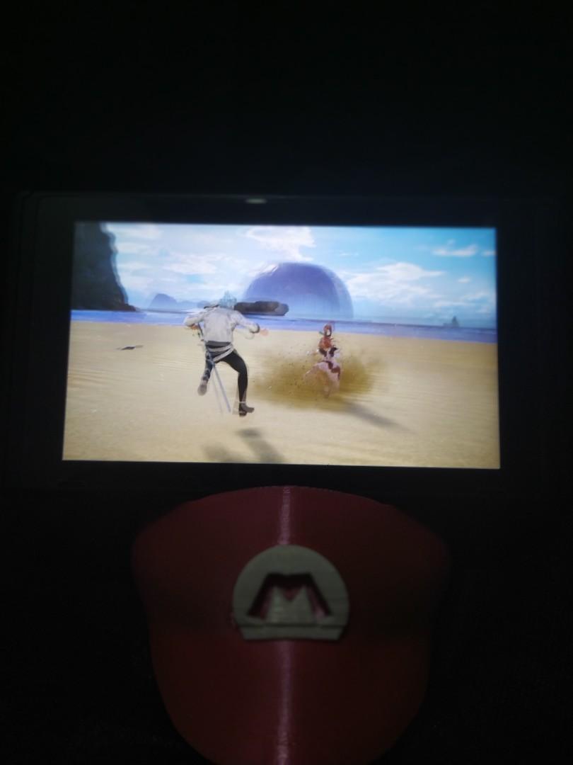 Nintendo switch stand (Category: Controllers) located in San Jose del Monte. Submitted by jkarllaker (Listing ID 1043837220, Image 2). Description: nintendo switch holder mario hat with charging port access.