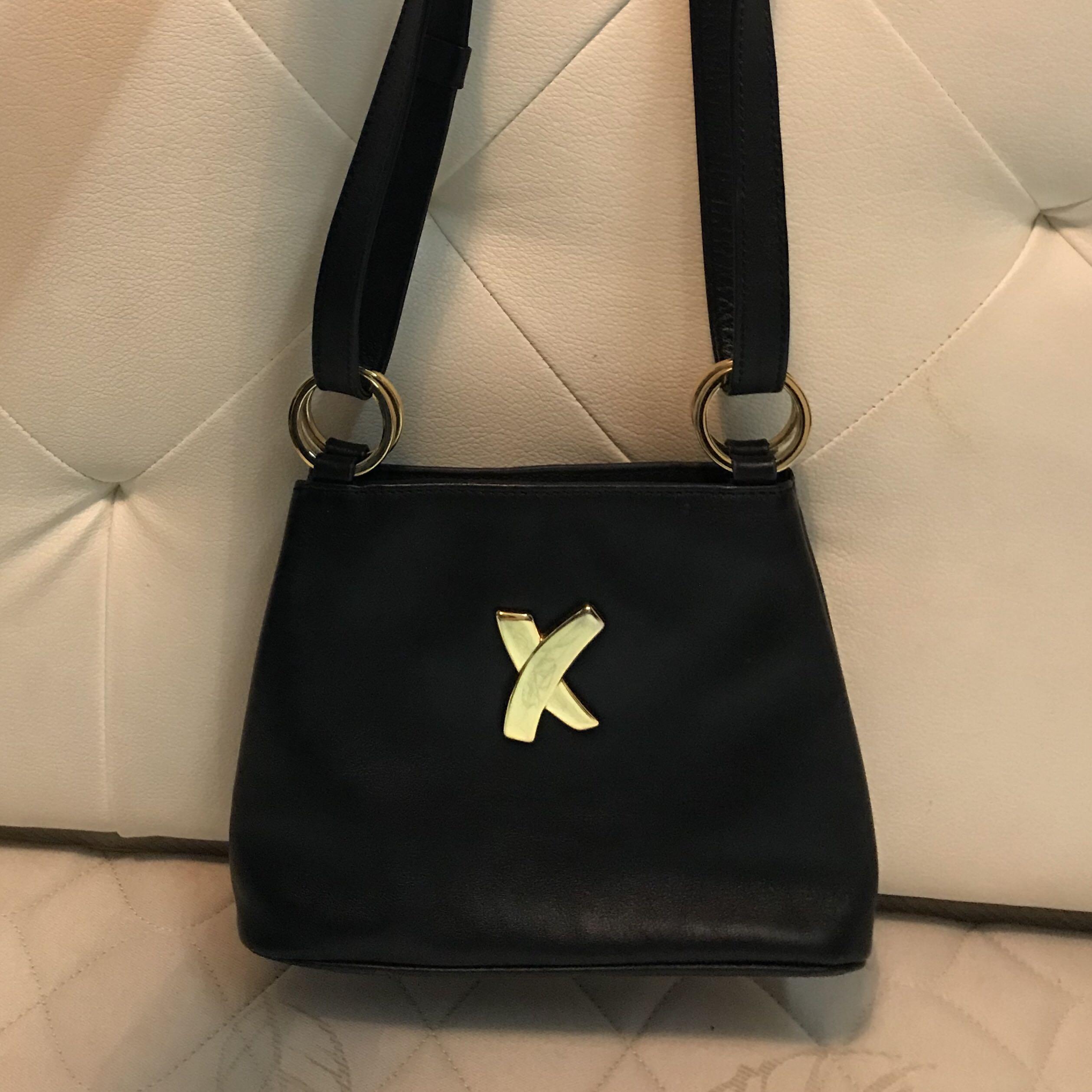 Paloma Picasso Two-Way Leather Bag (Category: Cross-body Bags) located in Orani. Submitted by gudstvff (Listing ID 1043881423, Image 1). Description: Vintage / Rare Find Can be worn like a sling / body bag or shoulder bag 100% Authentic Message me for more details & inquiries.