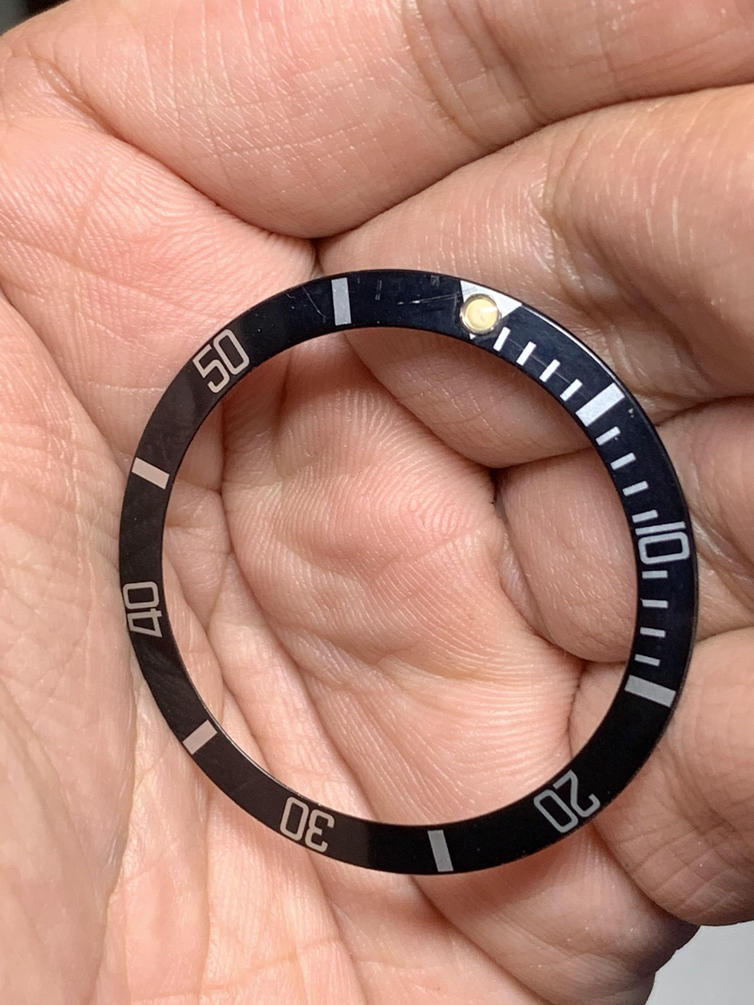 Genuine rolex store submariner bezel insert