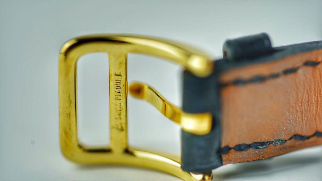 Hermes Kelly Watch (Category: Luxury Watches) located in San Juan City. Submitted by saristoreonline (Listing ID 1043971427, Image 3). Description: Pre-loved Hermes Kelly Watch ➡️Model size: small ➡️Yellow-gold plated steel case, 20 x 20 mm ➡️Mineral crystal ➡️Matte white dial ➡️Quartz movement, ➡️Swiss Made Hour, minute functions ➡️Long double tour strap in black Barenia calfskin, ➡️gold-plated steel pin buckle The leather used for the straps va