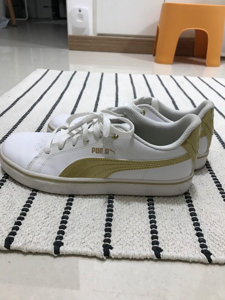 White and gold puma sneakers