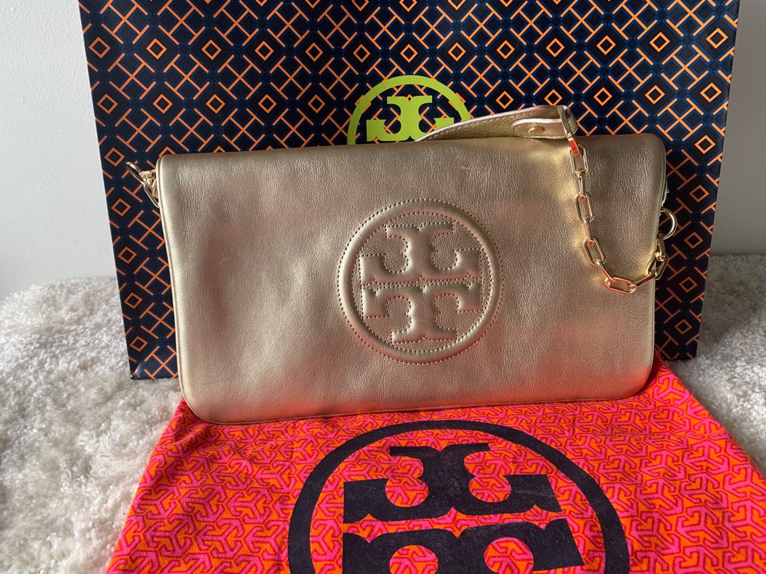 Authentic Tory Burch Reva Clutch Gold, Women's Fashion, Bags & Wallets,  Clutches on Carousell