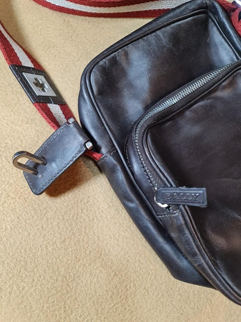 Bally Brown Leather Crossbody Bag (Category: Luxury Bags & Wallets) located in Cagayan de Oro. Submitted by dg_great_finds (Listing ID 1044864891, Image 2). Description: Here we have a stunning crossbody bag from Swiss luxury fashion house Bally. This is a perfect bag for travel as it csn hold passports, wallets and cellphones. The bag is made of genuine leather while the strap is in the iconic red and white stripes of the Swiss flag. Lock is mis