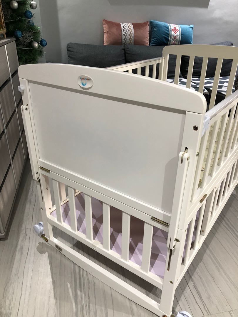 wooden crib with drawers