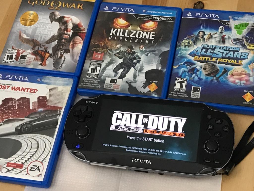 PS Vita Slim with Original Box and 5 Games Video Gaming Video