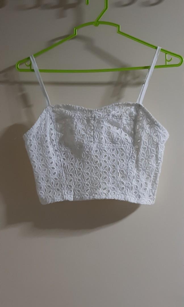 White eyelet spaghetti strap crop top (Category: Sleeveless) located in Santa Rosa. Submitted by adoptathing (Listing ID 1045060351, Image 1). Description: may fit XS-S frames bust laid flat: 12 inches has garterized back.