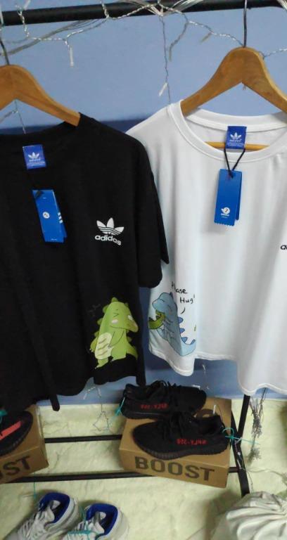 2Pcs Adidas Dinosaur Couple T Shirt (Oversized Cutting Style), Men'S  Fashion, Tops & Sets, Tshirts & Polo Shirts On Carousell